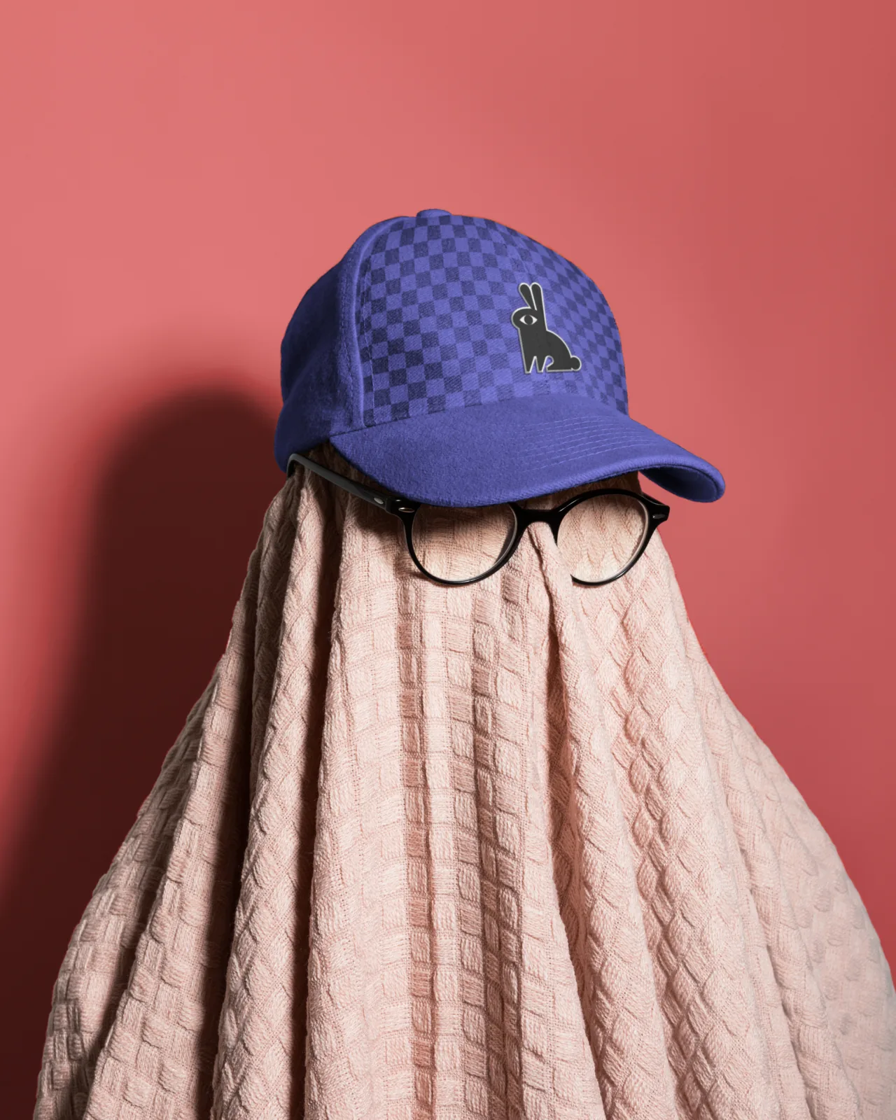 Branded cap on a draped figure
